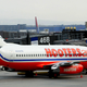A Hooters plane arrives at Gate 47 for the inauguration of the airline’s new service between Newark and Myrtle Beach, South Carolina at Newark Liberty International Airport April 3, 2003 in Newark, New Jersey.